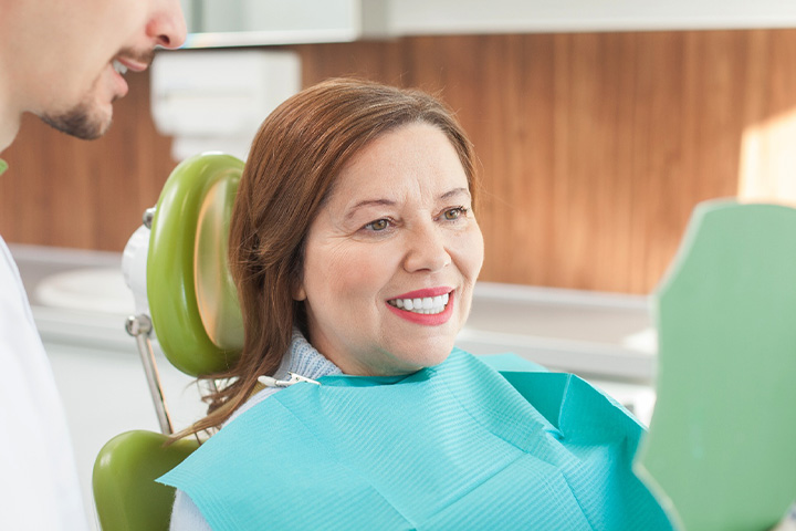 Woman smiling at the dentist.