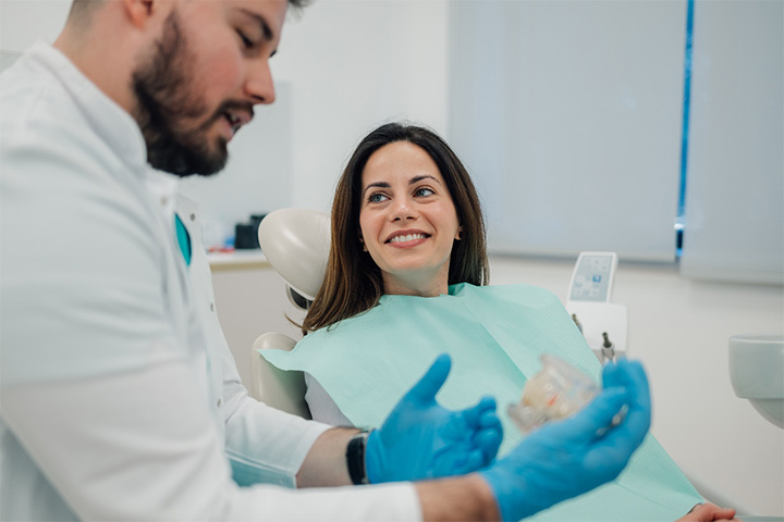 Woman smiling in the dental chair.